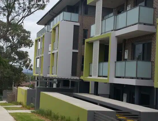 Affordable housing complex in St Marys with modern architecture and green accents.
